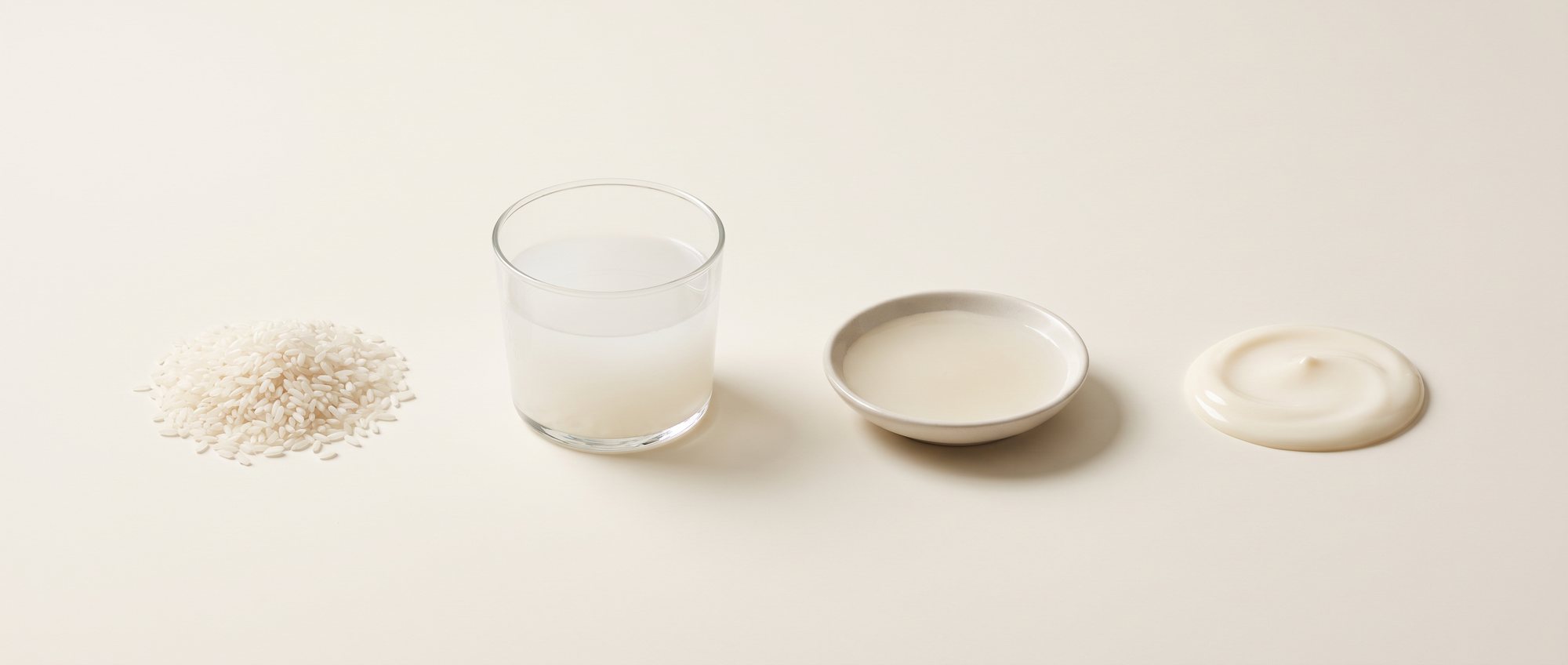 Four stages of one ingredient — rice grains, rice water, rice extract, finished cream
